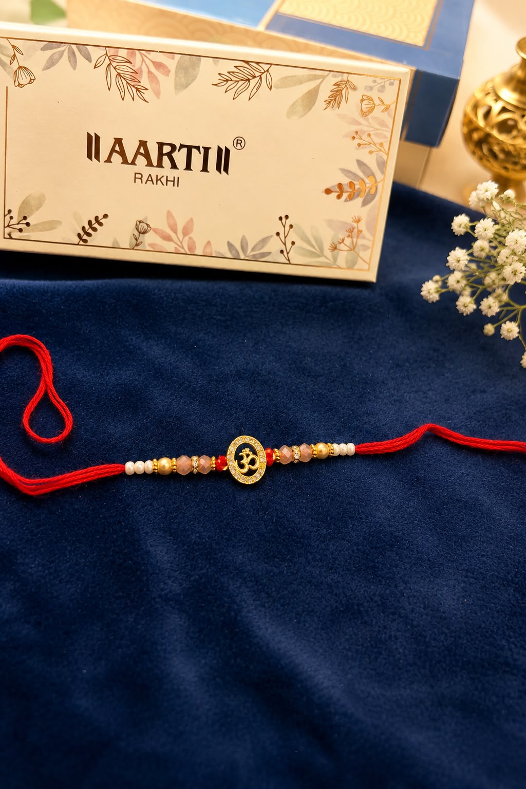 AD sleek Om Rakhi
